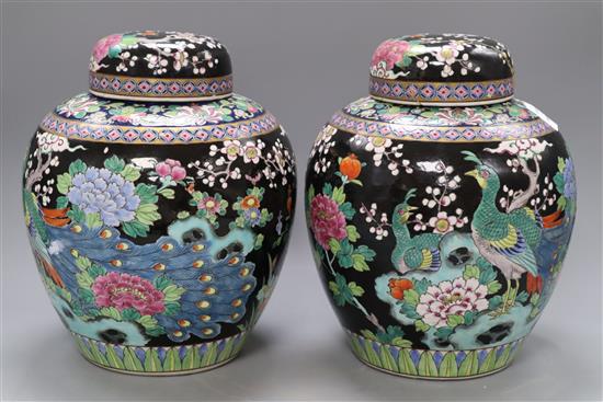 A pair of Japanese famille noire vases and covers, overall height 28cm